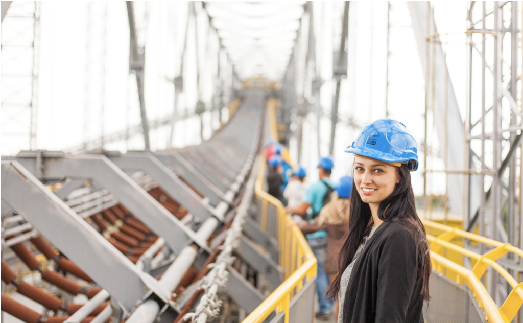 woman standing on metal bridge