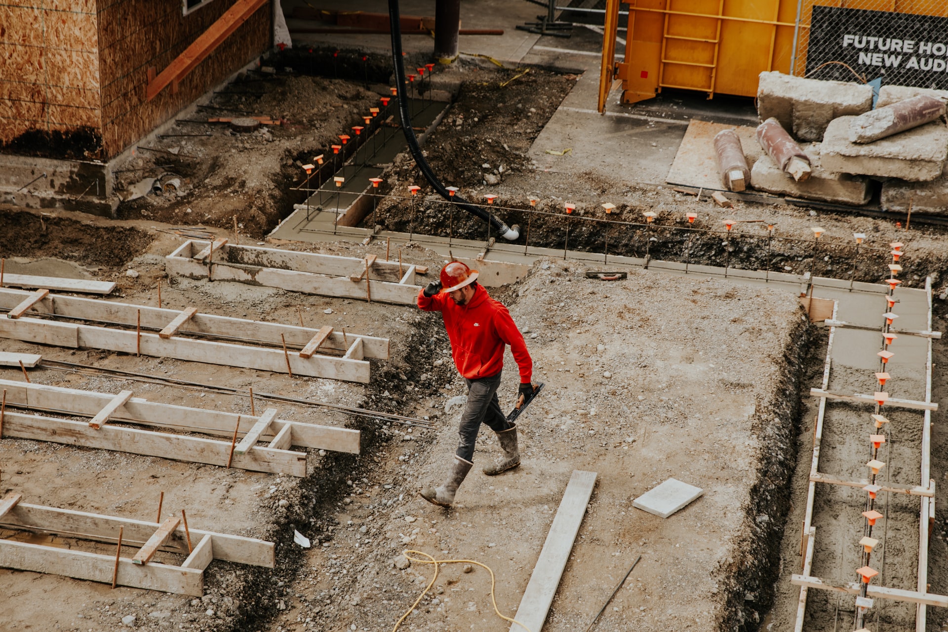 man in hard hat remodeling concrete worker