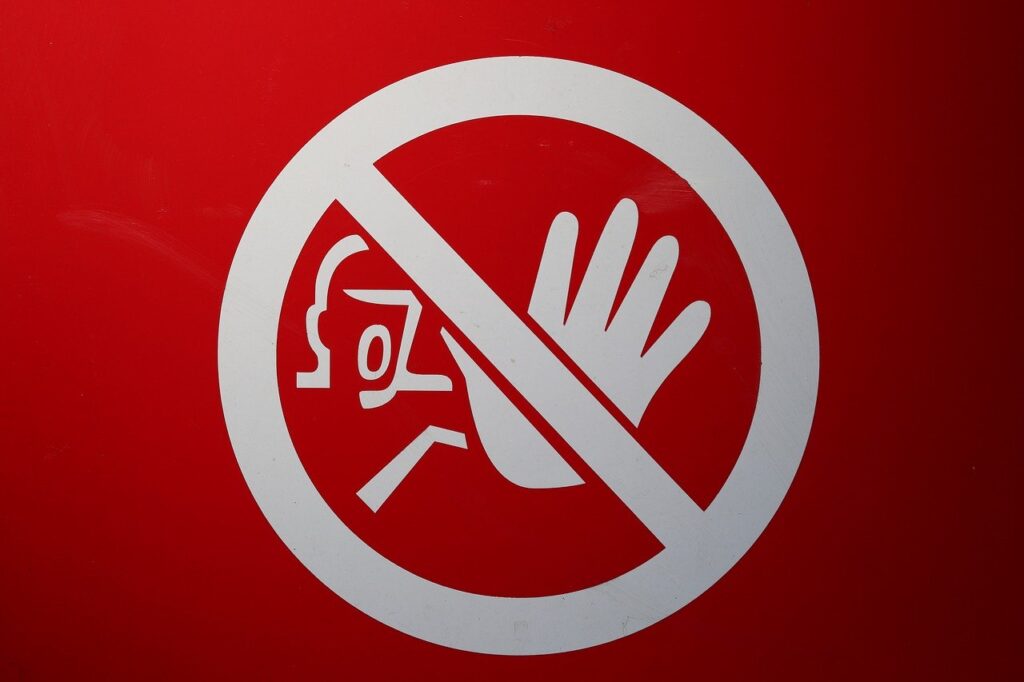 red denial sign with hand