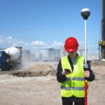 construction site with man surveying land