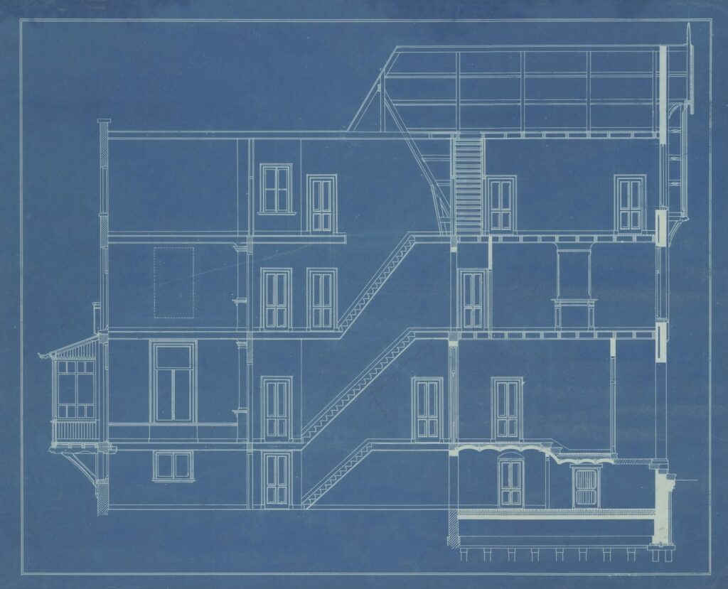 Architectural blueprint showing detailed building plans for permit review