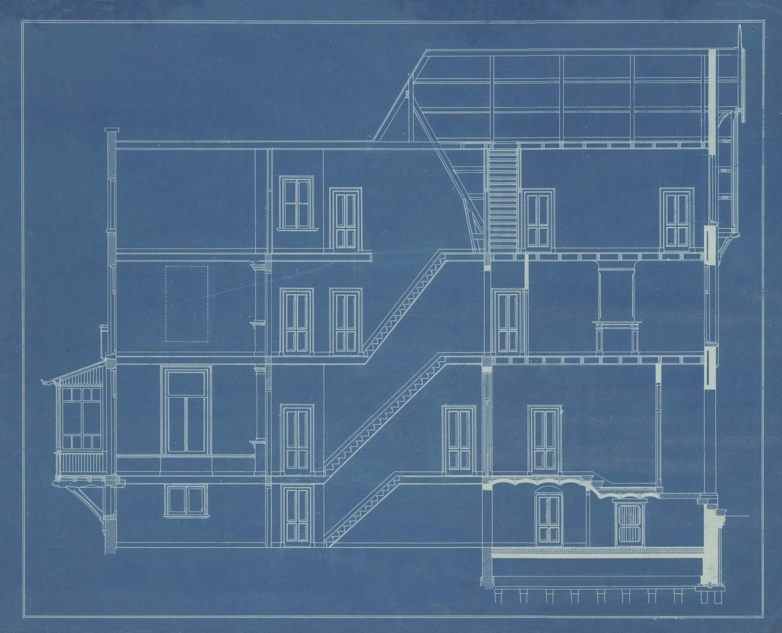 Architectural blueprint showing detailed building plans for permit review