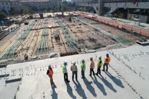 Construction team reviewing site plans on an active commercial development project