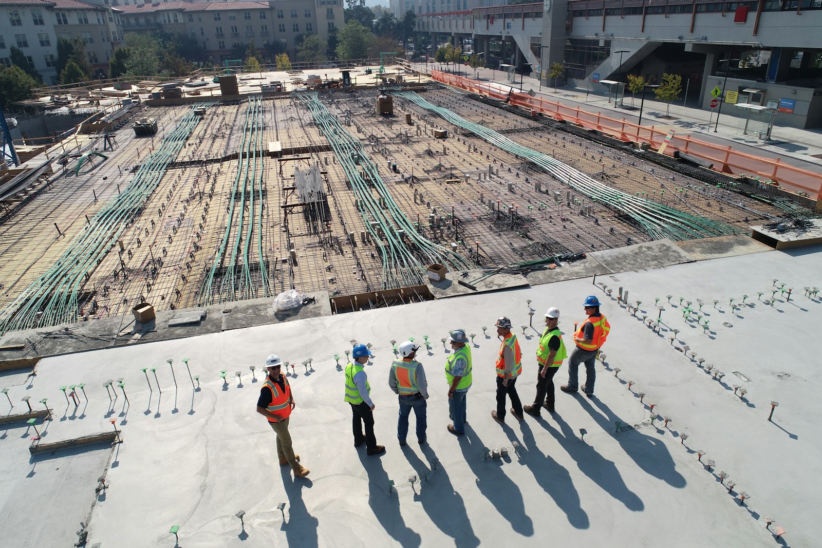Construction team reviewing site plans on an active commercial development project