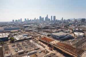 Aerial view of downtown Los Angeles with an active construction site, the kind of project that is screened against the 33 CEQA categorical exemptions